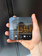 Gros plan sur le bouton central du MagnetQuran